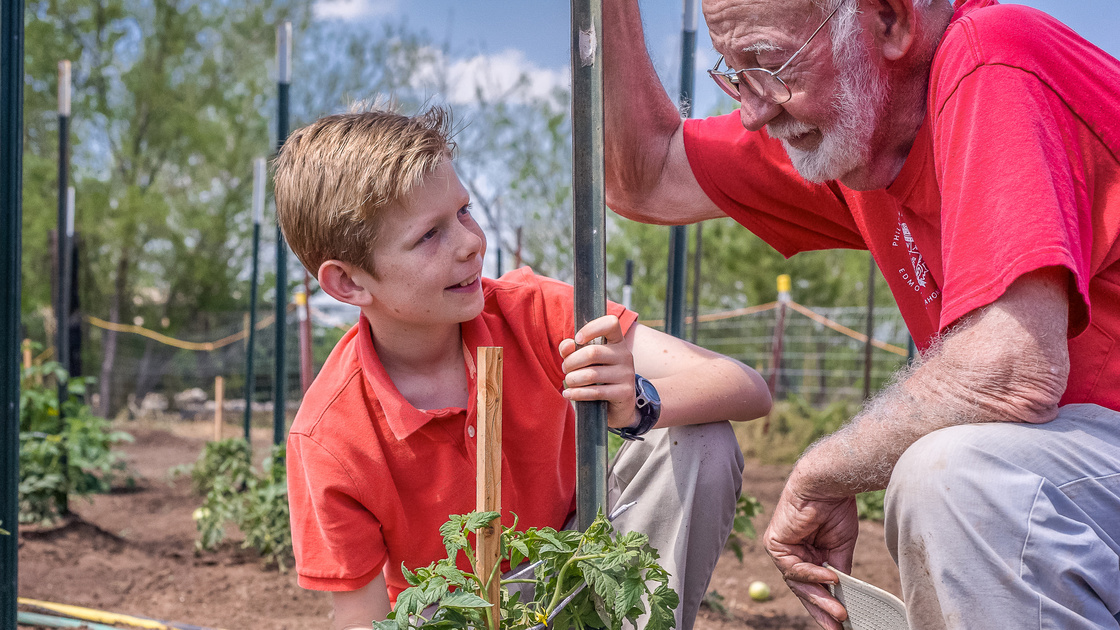 Raymond Wickware teaching Jude Flurry about gardening