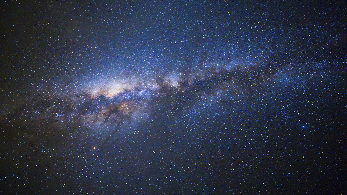 Wide field long exposure photo of the Milky Way.