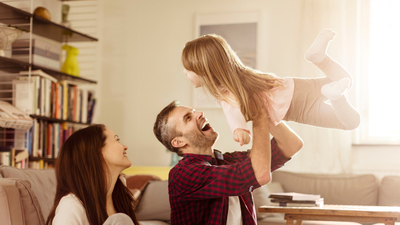 Close up of a happy  family playing at home