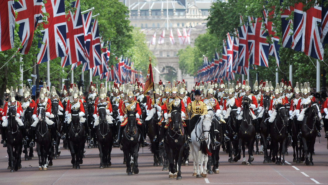 London, United Kingdom - June, 13th 2006:Mounted Horse guards parade through London beneath British flags in a ceremonial parade