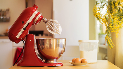 red stand mixer mixing white cream, kitchen 