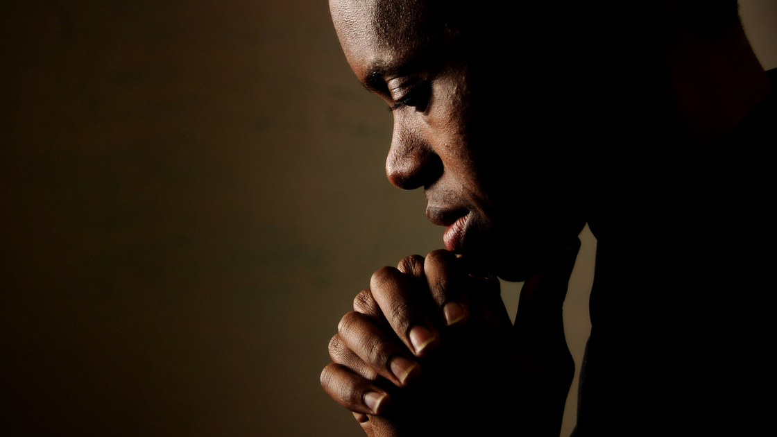 Young man praying.