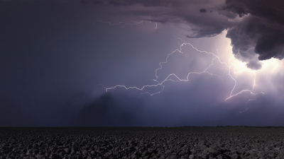 Storm clouds over field