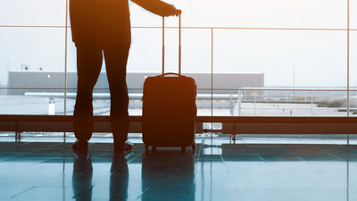 business man with luggage waiting in the airport