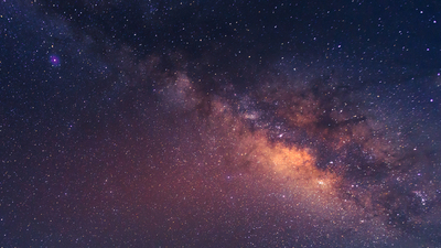 Wide field long exposure photo of the Milky Way. Cygnus region of the Milky Way with the Summer Triangle visible.