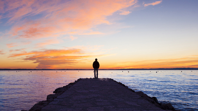 Man standing on jetty