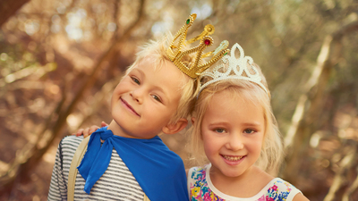 Portrait of two little children playing together outdoors