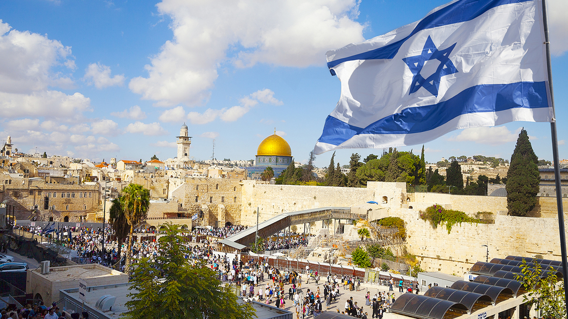 Israel flag with a view of old city Jerusalem and the KOTEL- Western wall