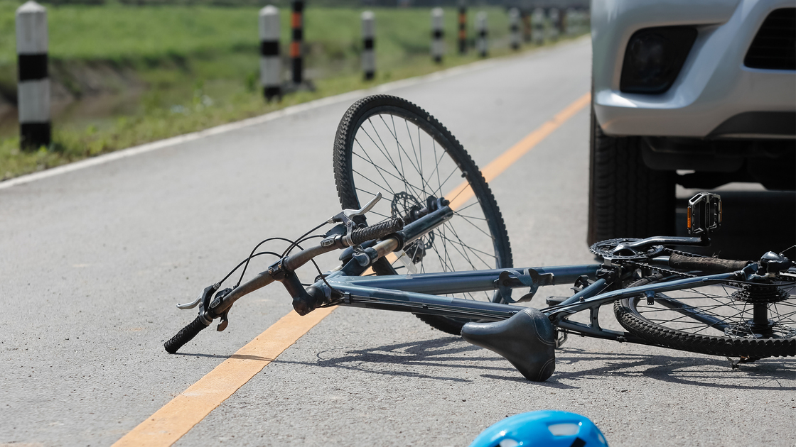 Accident car crash with bicycle on road