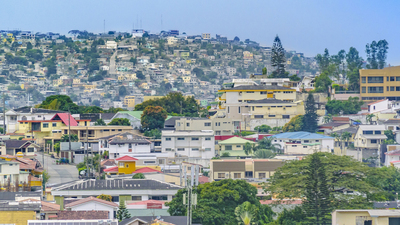 Elegant neighborhood and favela hill view of Guayaquil city, Ecuador 16x9