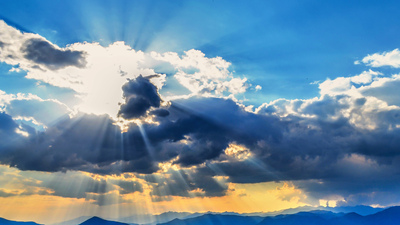 Sun appearing through clouds