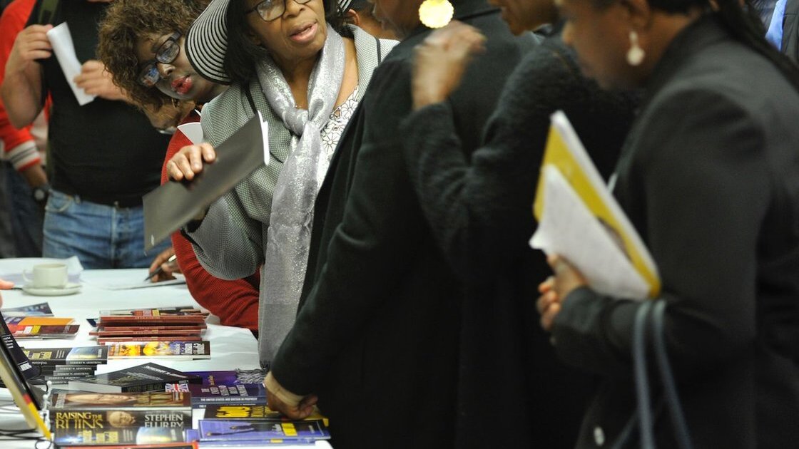 PAC London guests at literature table 