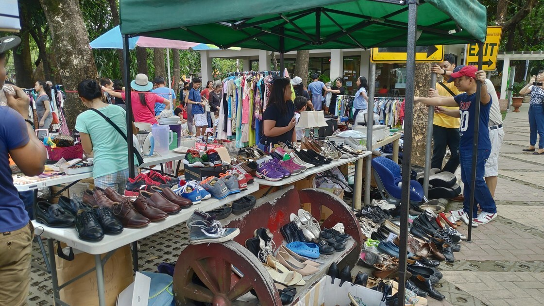 ACT Philippines rummage sale, guests looking through items, shoes
