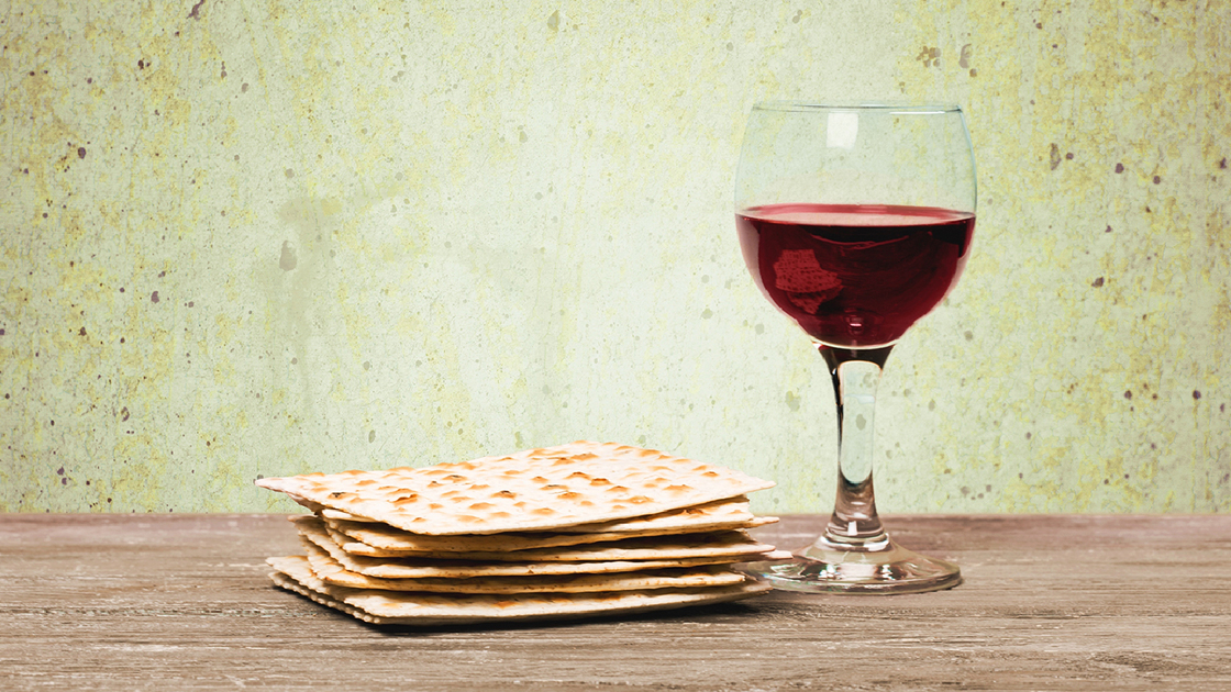 Pesach. Passover background. wine and matzoh (jewish passover bread)  over wooden background. vintage effect process.