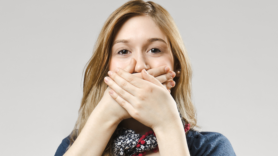 Girl covering her mouthSimilar images: