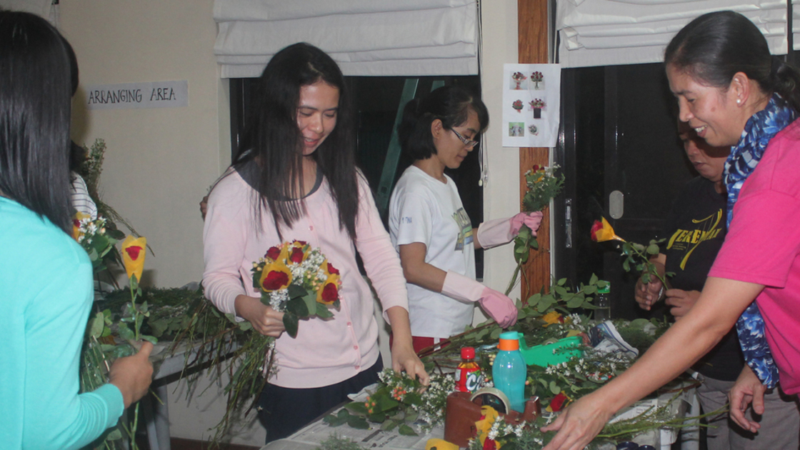 ACT PHIL MD Flower Fundraiser, women making flower arrangements 