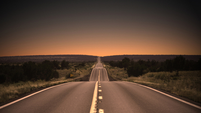 Sunset highway in Northern Arizona. Vignetting and desaturated.