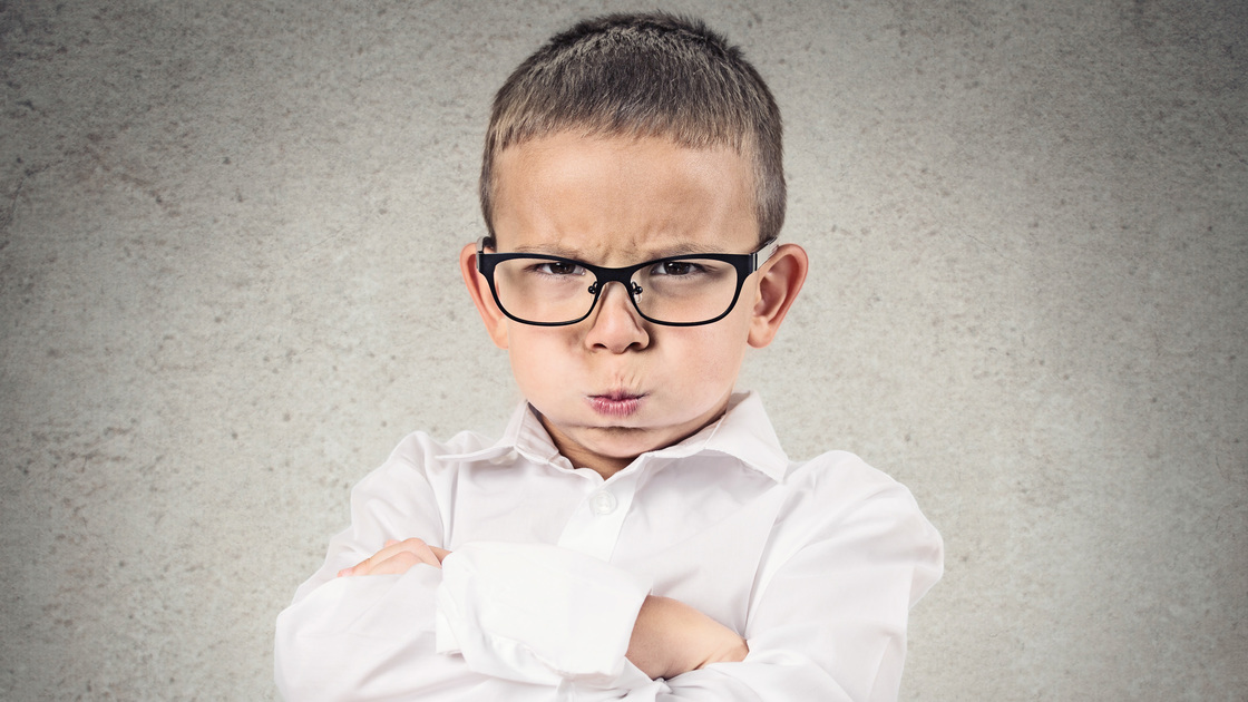 Closeup portrait Angry Boy, Blowing Steam, puffing out his cheeks about to have Nervous atomic breakdown, isolated grey background. Negative human emotion, Facial Expression feeling attitude reaction