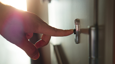 Hand ringing doorbell