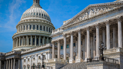 The United States capitol building in Washington DC on a summer day.