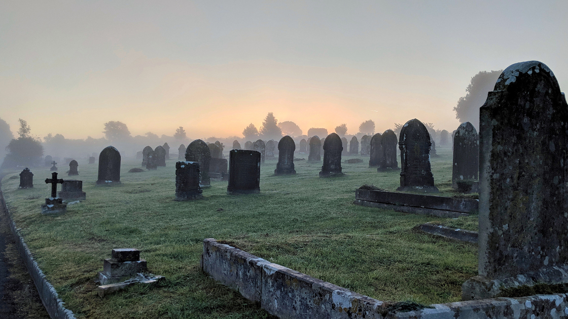 Misty sunrise at a graveyard