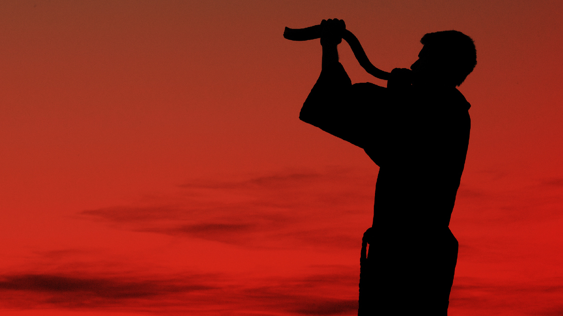 Reese blowing a shofar