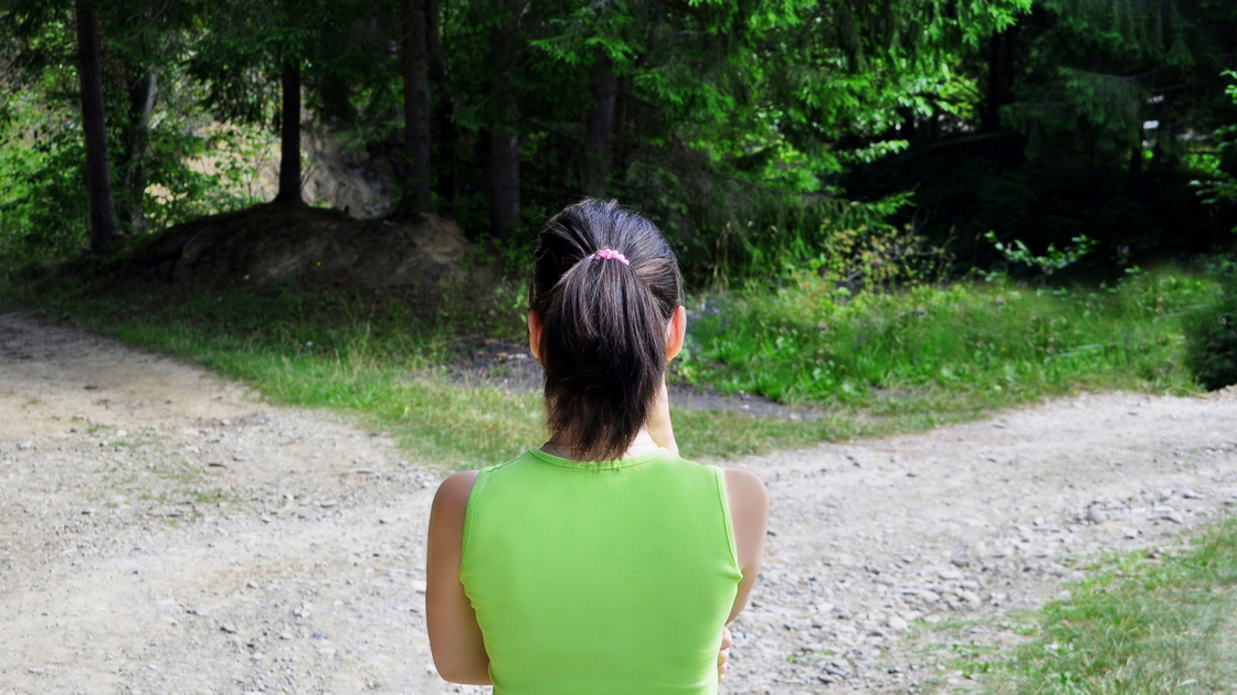 Girl with a choice near the forked road