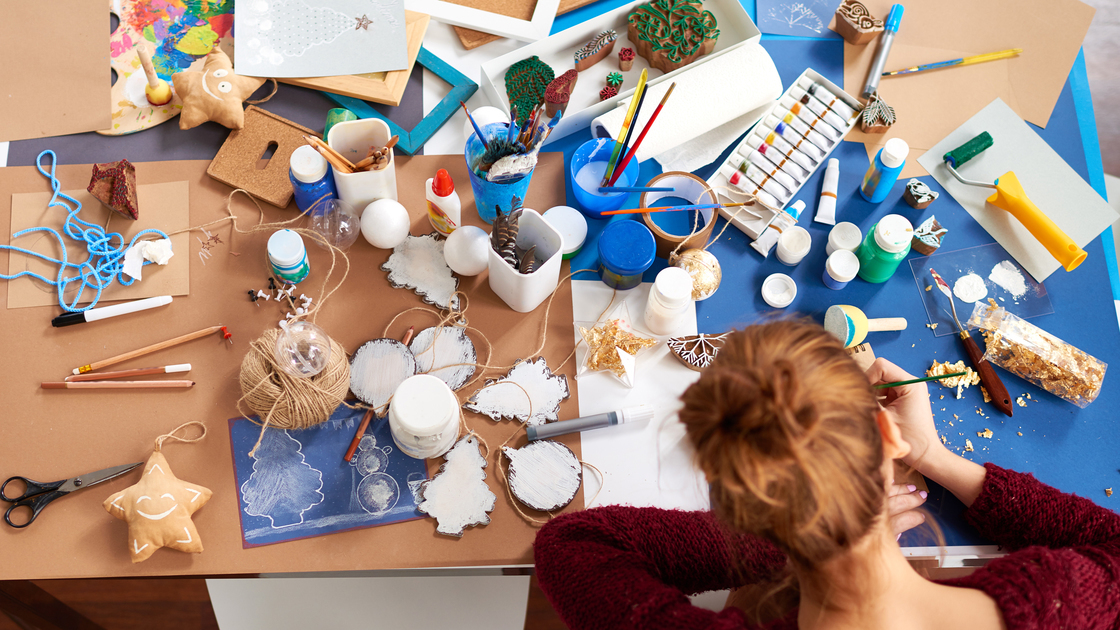 Woman artist working at her desk