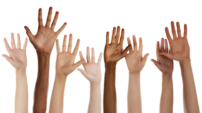 This is a photo taken in the studio of a mix of children raising their hands isolated on a white background.Click on the links below to view lightboxes.