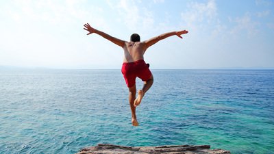 Young man diving.