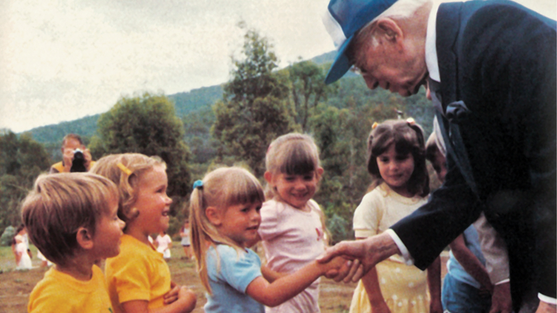 Herbert W. Armstrong meets children at an Australian youth camp.