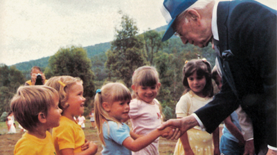 Herbert W. Armstrong meets children at an Australian youth camp.