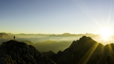 a climber observing sunset.