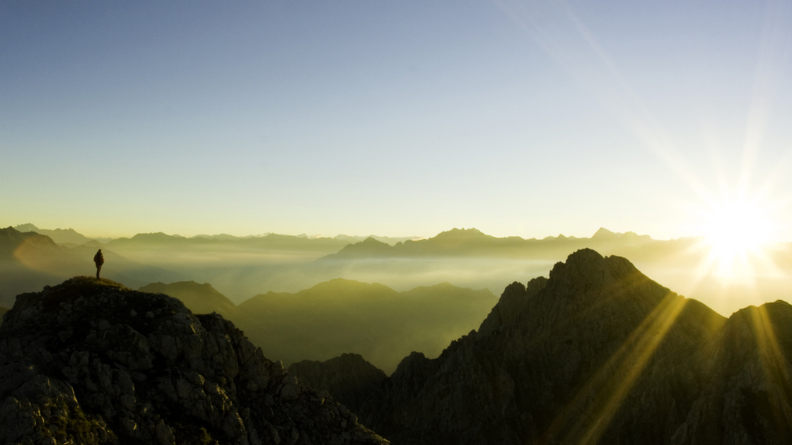 a climber observing sunset.