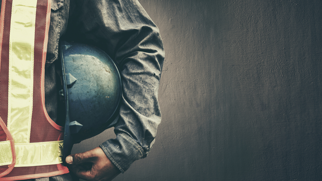 Man holding blue helmet close up