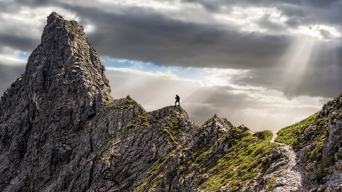 One Single Climber on the Ascent to the Summit