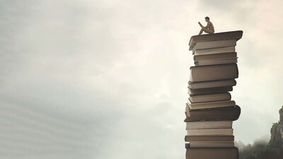 Boy on books representing one pure language