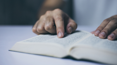 Man is reading the holy bible.