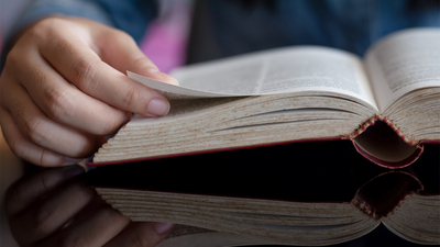 Man hand opening and read book. Knowledge concept.