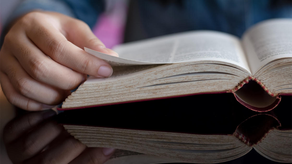 Man hand opening and read book. Knowledge concept.