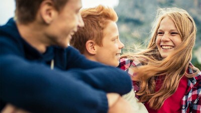 siblings smiling and laughing