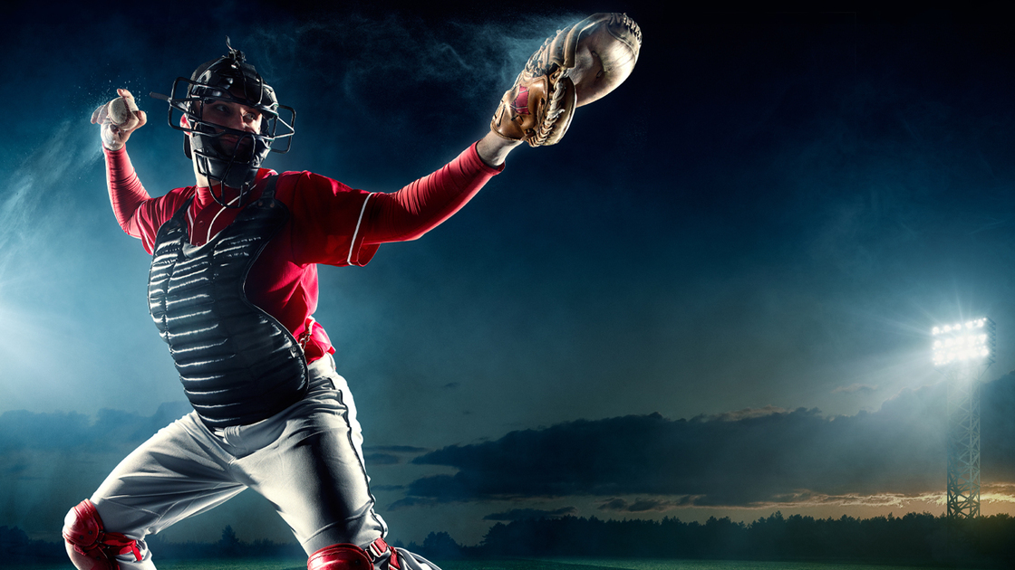 Image of a baseball catcher ready to catch baseball. He is wearing unbranded generic baseball uniform. The game takes place on outdoor baseball stadium. The stadium is made in 3D.