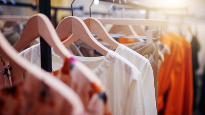 Clothing on hanger at the modern shop boutique