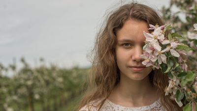 A girl in an orchard