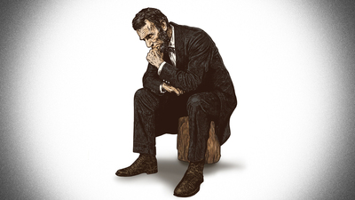 Abraham Lincoln in deep thought while sitting on a log