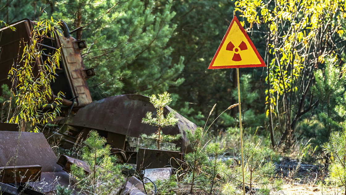 sign of radiation hazard on the background of radioactive garbage