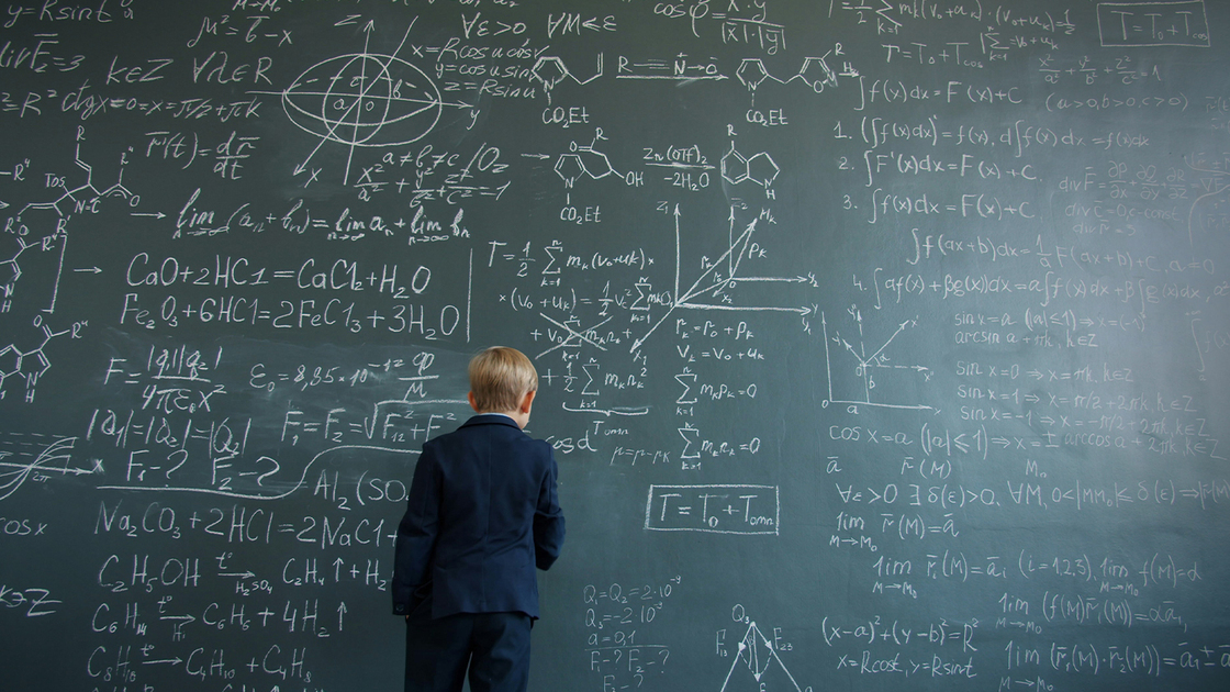 Boy does complicated proofs on chalk board
